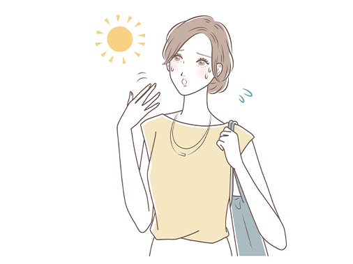日差しを受けて暑がる女性のイメージ