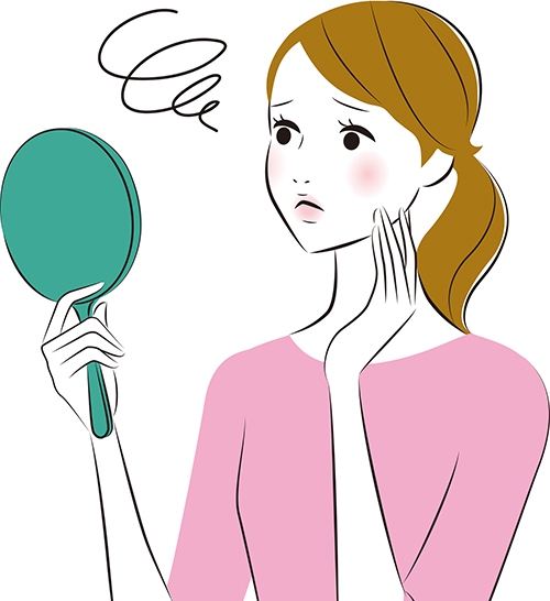 鏡を見る女性のイメージ